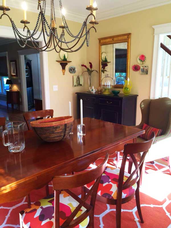 Vibrant pink reds New England style dining room arranged by Colleen Van Houten